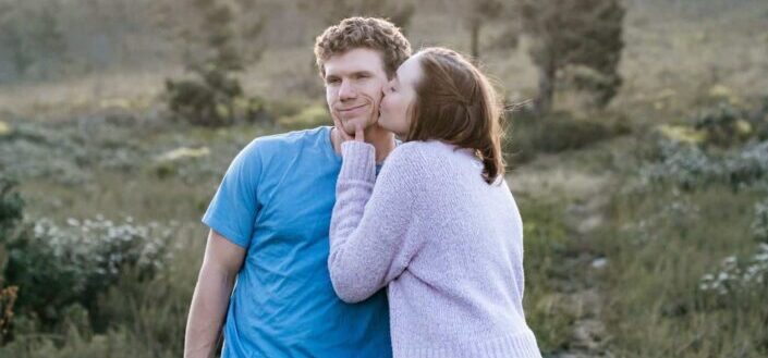 Woman Kissing a Man on the Cheek