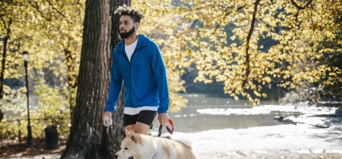 African american male walking his dog