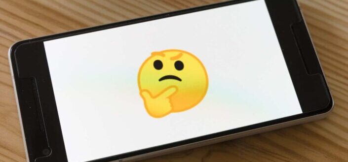 Black Phone Displaying Yellow Thinking Emoticon