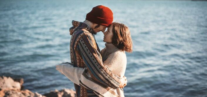 Romantic couple spending sweet moments near sea