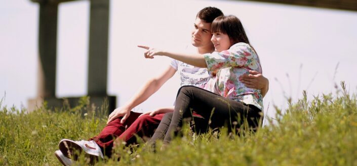 Sweet couple sitting on the grass