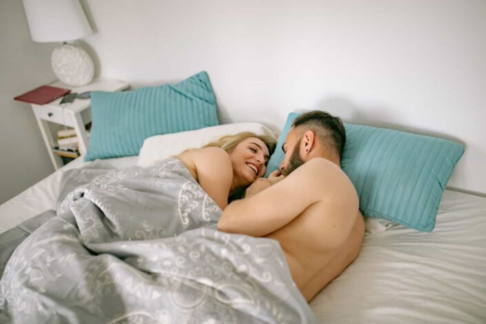 Couple lying in bed together