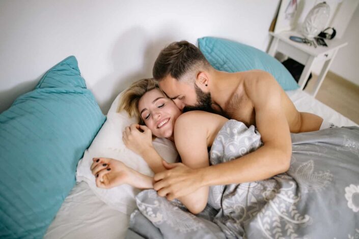 Couple together in bed