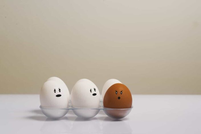 Eggs in tray on white surface