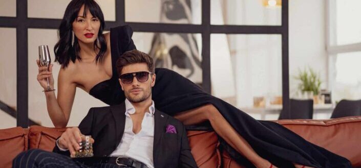 Elegant dressed couple on sofa