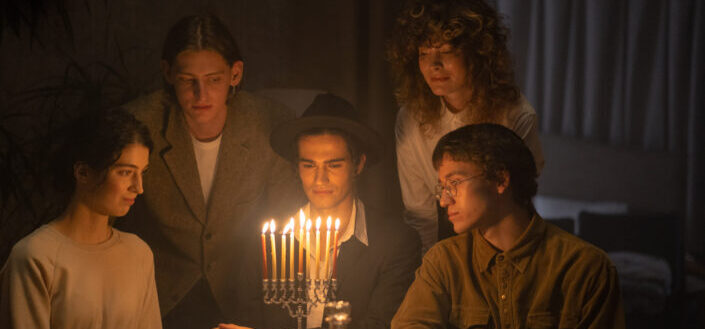 Family celebrating hanukkah