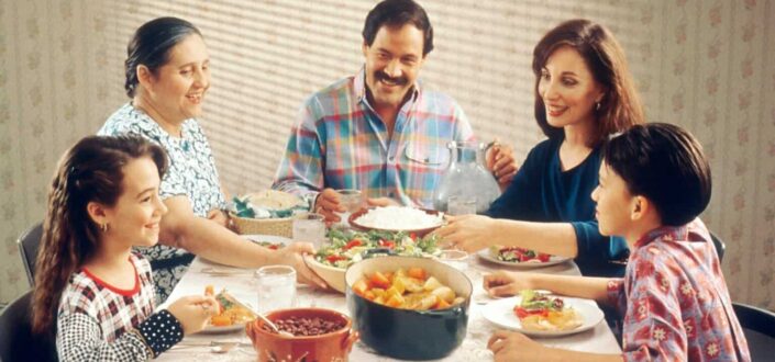 Mexican family enjoying meals together