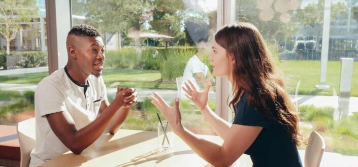 Couple At The Table Having a Discussion