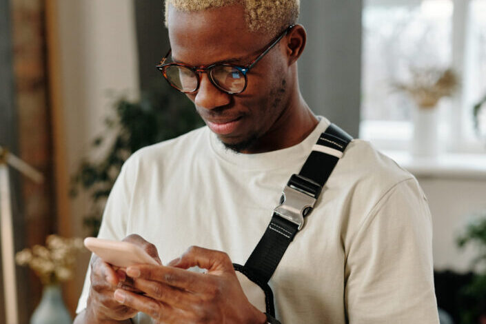 Man Holding a Mobile Phone