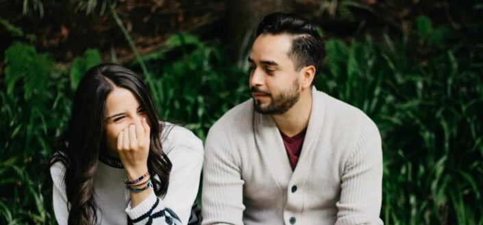 Man Sitting Beside Laughing Woman