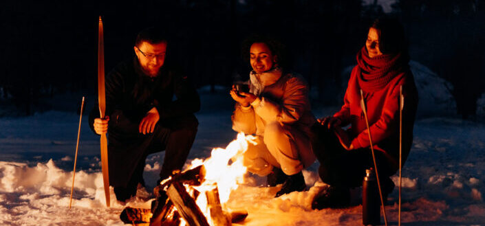 People sitting around a campfire