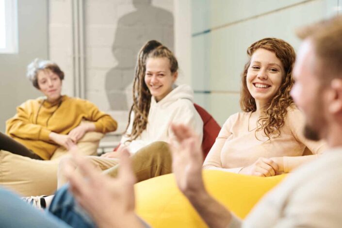 Friends Sitting on Beanbags Having a Laugh