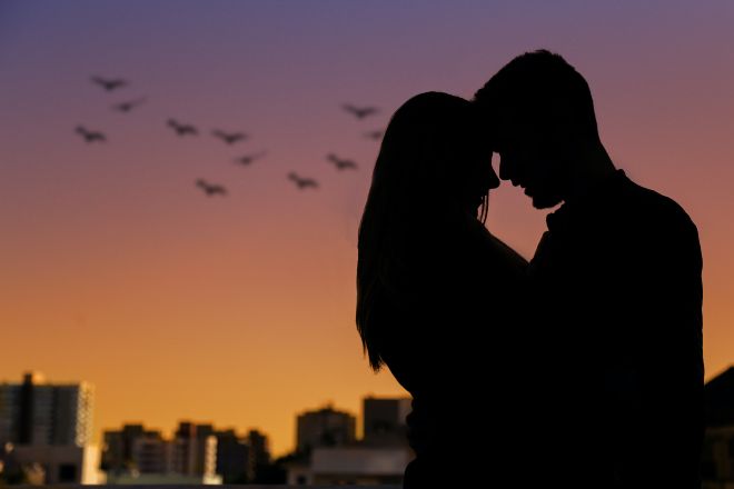 Couple Hugging While the Sun Sets - SouI Bond