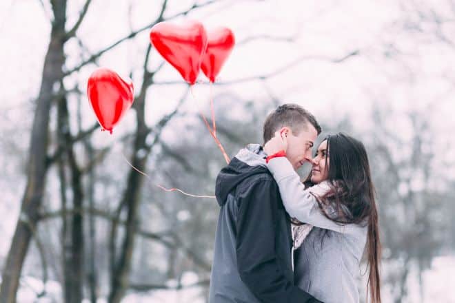 Couple hugging in winter with balloons - Soul Tie