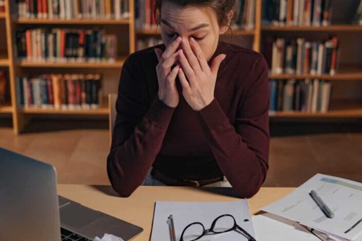 Tired woman in the library