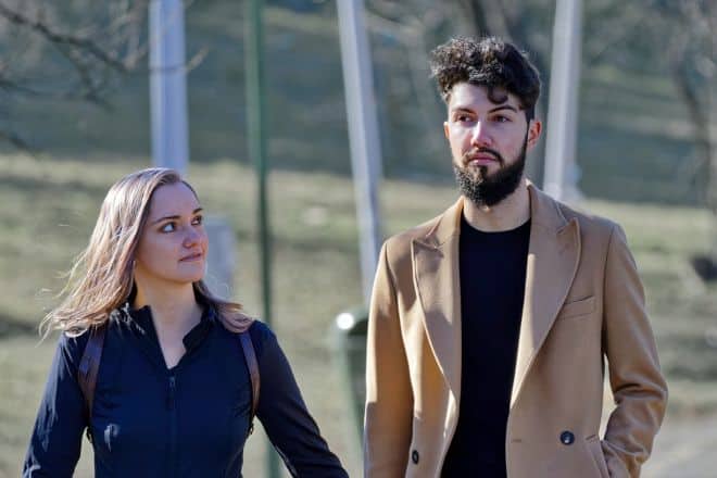 Couple wearing casual attire while walking - Weird Soulmate Signs