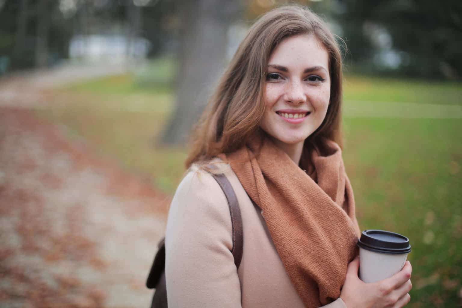 Woman holding disposable cup