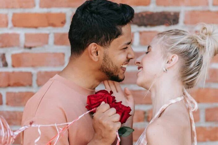 Couple Holding Red Roses