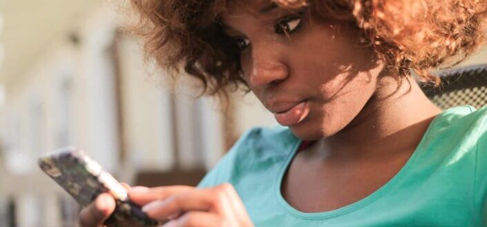 Woman using smartphone during daytime