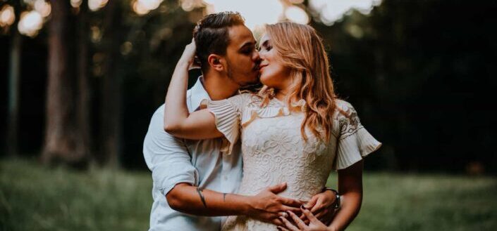 Couple kissing in park