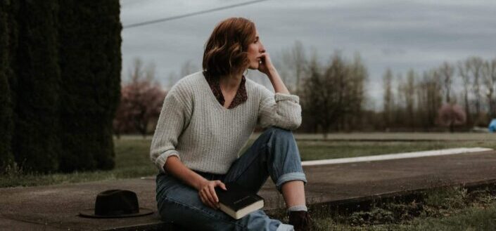 woman sitting on ground